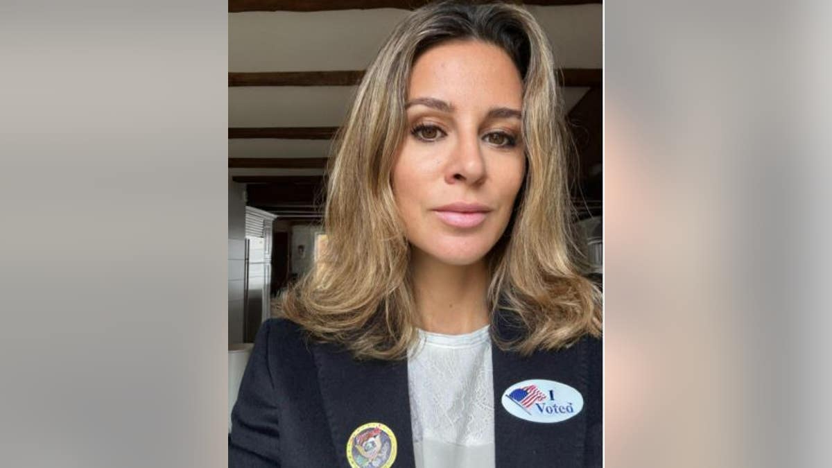 Alejandra Silva with an I voted stick on her blazer