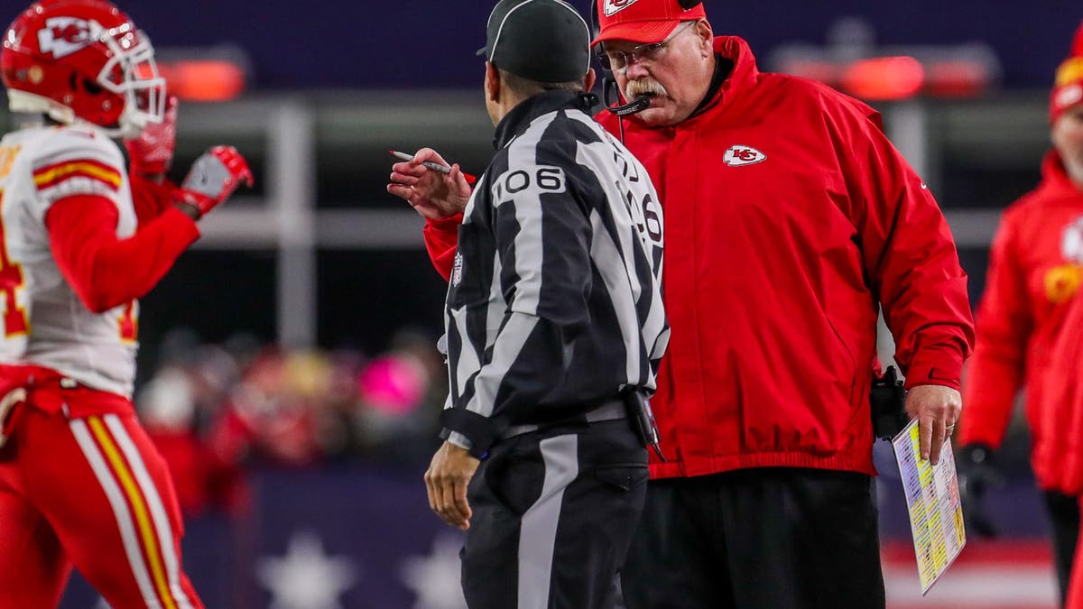 Andy Reid talks with the referee