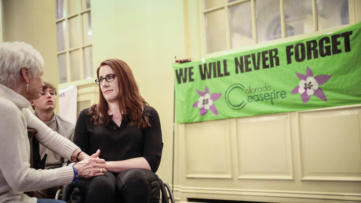 Columbine school shooting survivor Anne Marie Hochhalter (right) talks with Sue Townsend, the stepmother of shooting victim Lauren Townsend, during a 25th Year Remembrance ceremony on April 19, 2024.