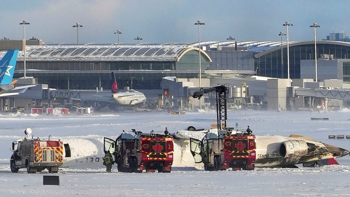 Conversely turned Delta aircraft in the snow at Toronto Airport