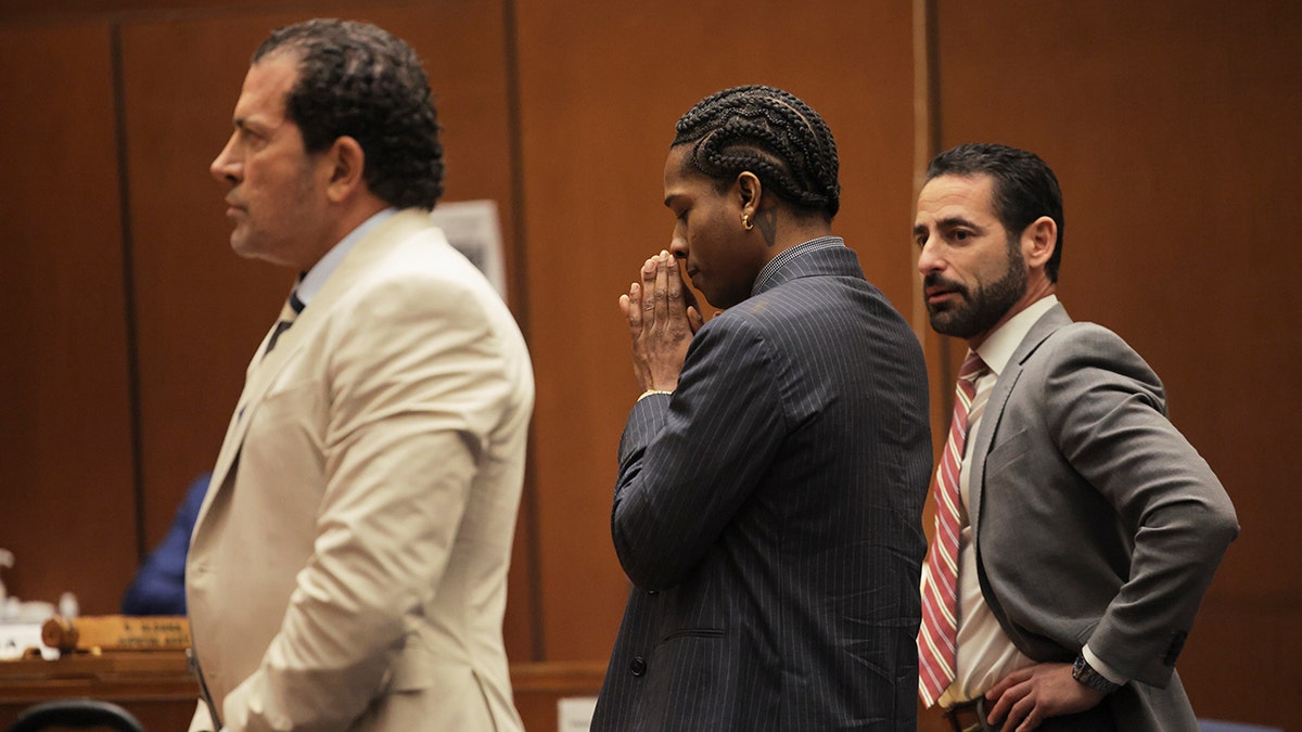 A$AP Rocky stands in court to hear verdict read.