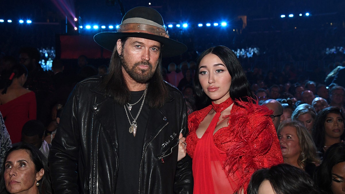 Billy Ray Cyrus and Noah Cyrus posing together