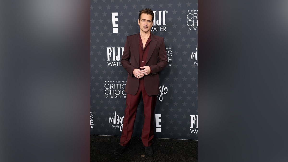 Colin Farrell walked the red carpet in a red suit.