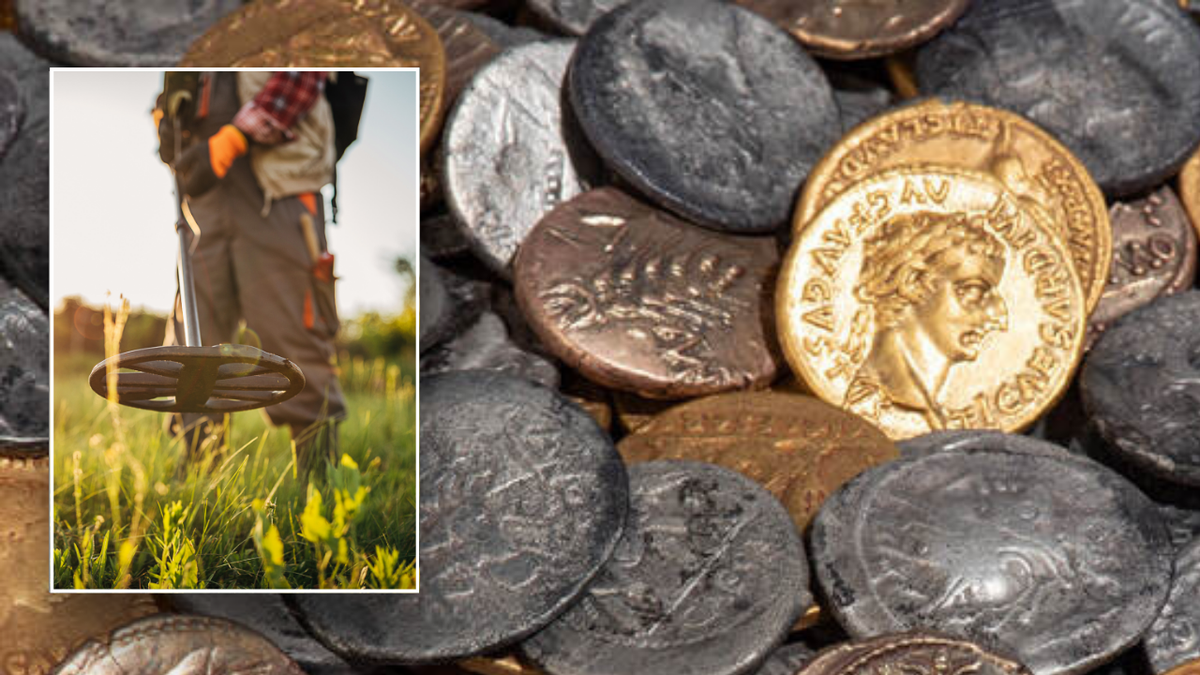 Metal detector next to silver currencies