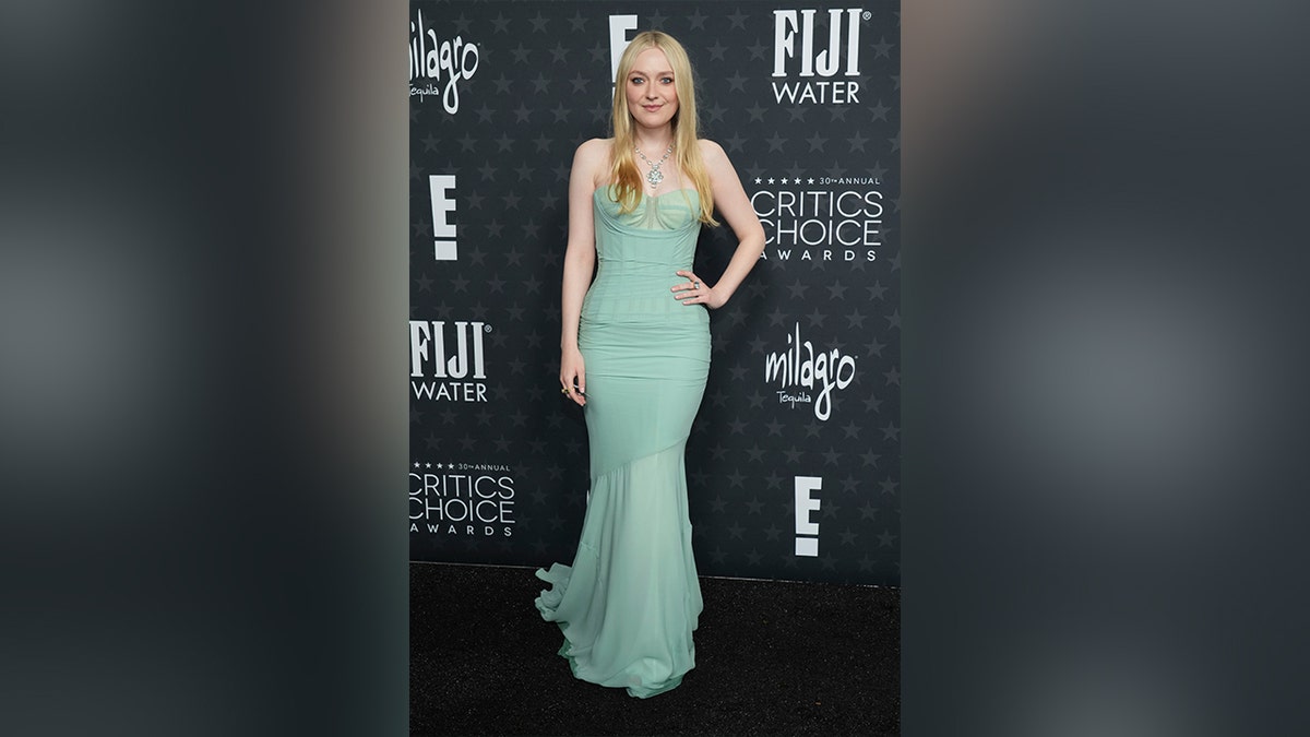 Dakota Fanning wore a strapless mint green dress with a sheer skirt.