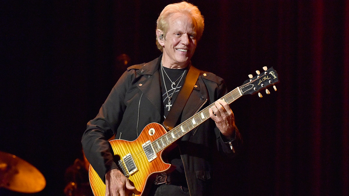 Don Felder on stage with his guitar