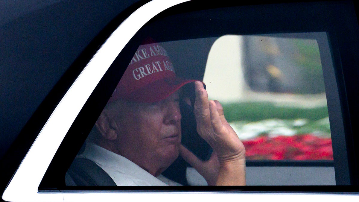 Donald Trump waves supporters