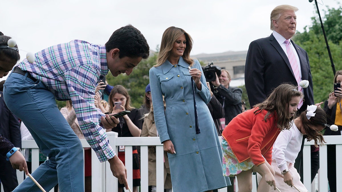 President Trump and First Lady Melania Trump watch the White house Easter Egg Roll take place