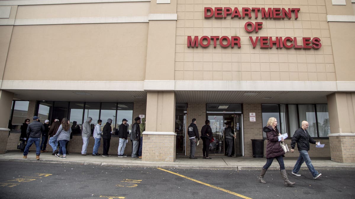 People Wait Outside a Department of Motor Vehicles Office On Long Island on January 31, 2020.