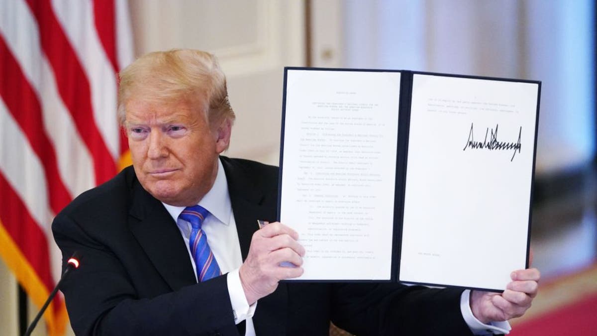 President Donald Trump holds an executive order "The National Council of the President of the American Worker and the Consultative Council for the American Manpower Policy." Which was signed during the meeting of the US Manpower Consultative Council in the Eastern Chamber of the White House in Washington, DC, on June 26, 2020.