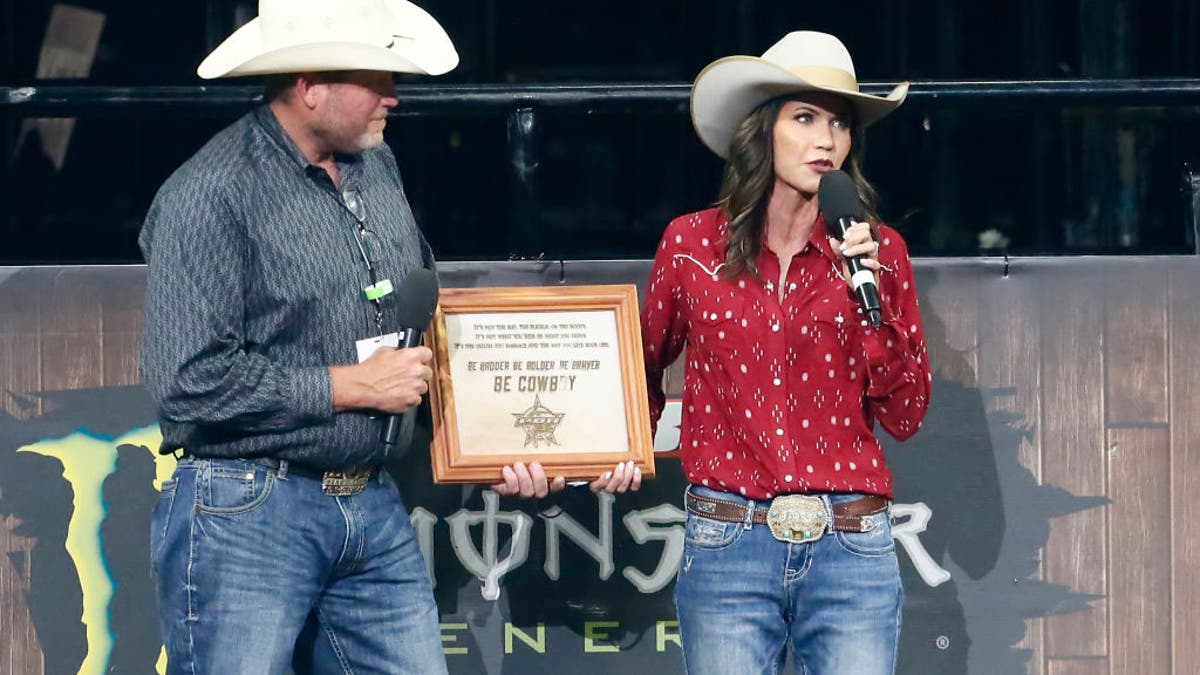 Kristi Noem receiving an award at a rodeo in 2020.