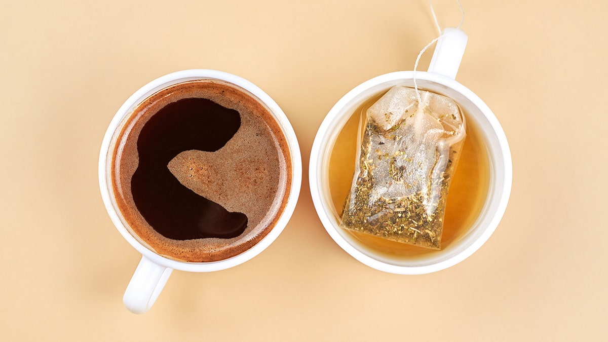 Mugs of coffee and tea next to each other, as seen from above.