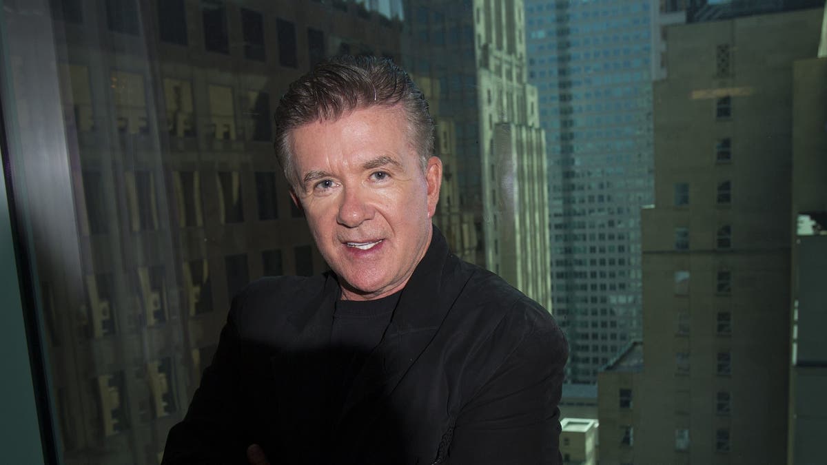 alan thicke looking at camera with his arms crossed