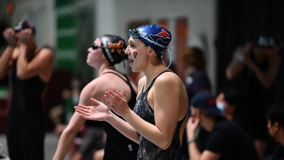 A swimmer cheering on team