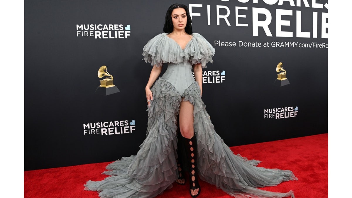 Singer Charli XCX wears periwinkle dress at Grammy Awards.