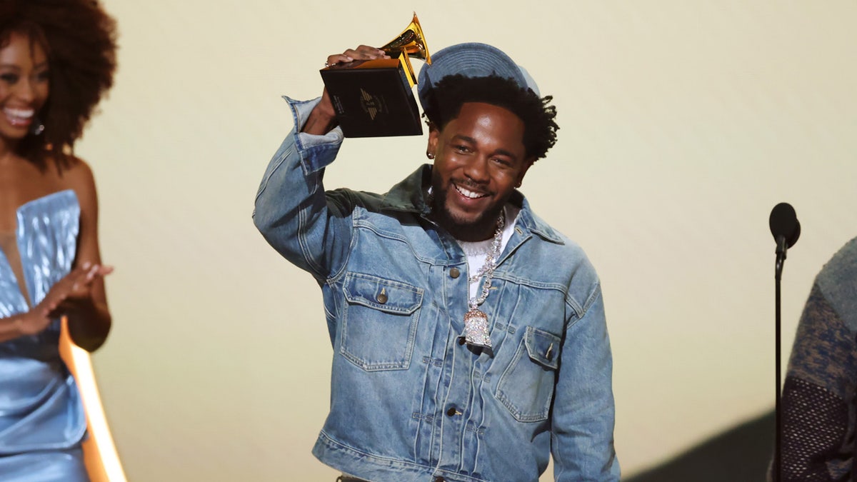 Rapper Kendrick Lamar rocks double denim at Grammy awards.