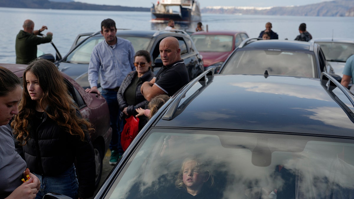 People wait for ferry at port of Piraeus