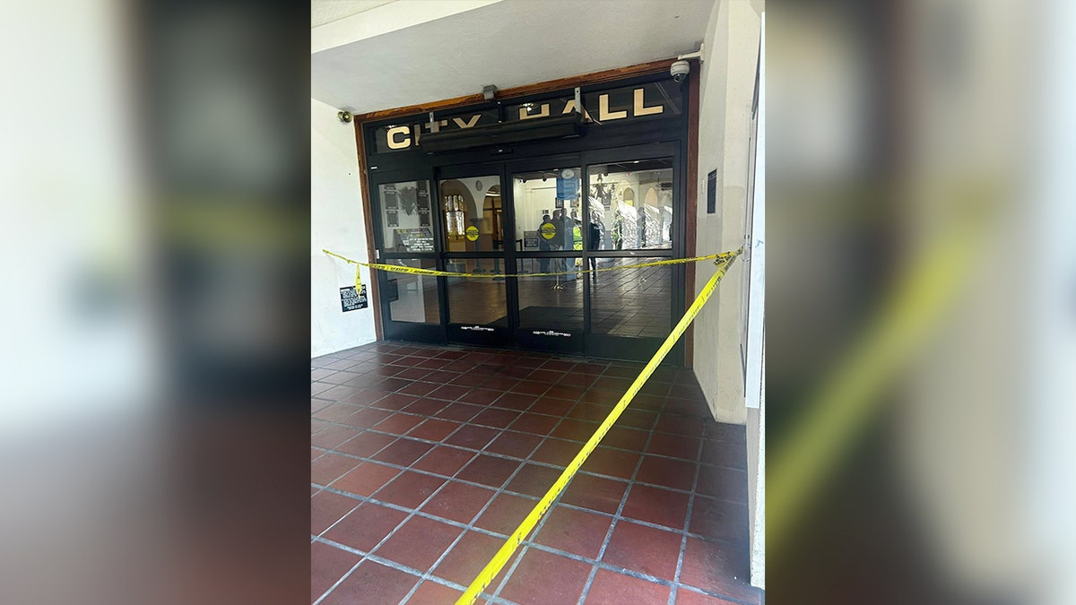 city hall entrance with yellow tape infront