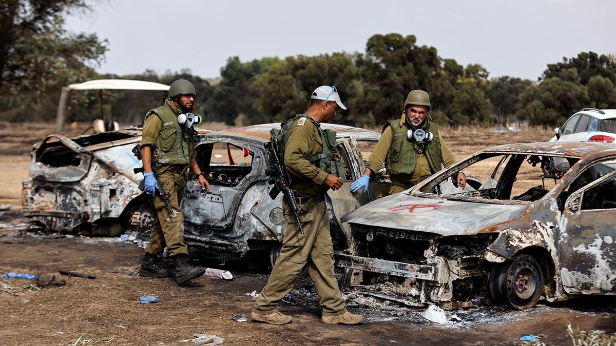 IDF soldiers check out the consequences of Hamas attacking Nova music festival