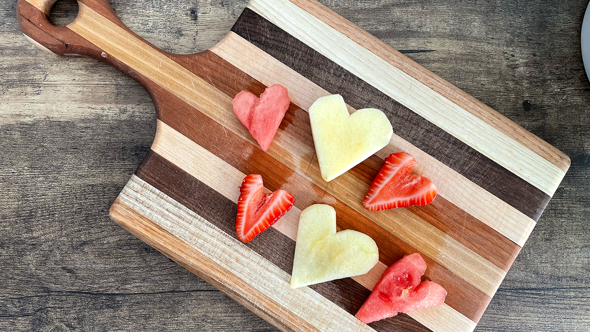 Apples, watermelon and strawberries cut into heart shapes