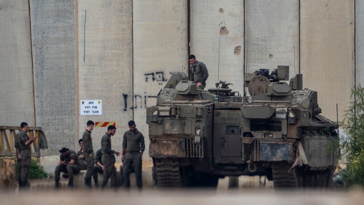 Israeli soldiers adjacent   Gaza Strip