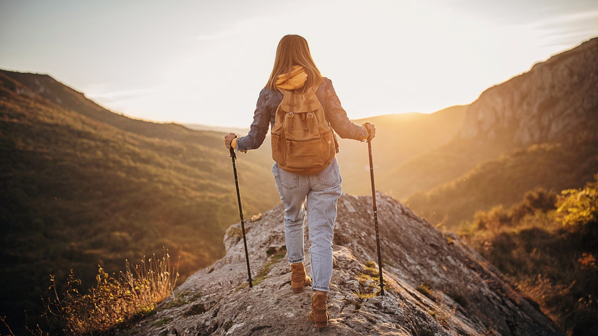 Women overlook the scene while hiking.