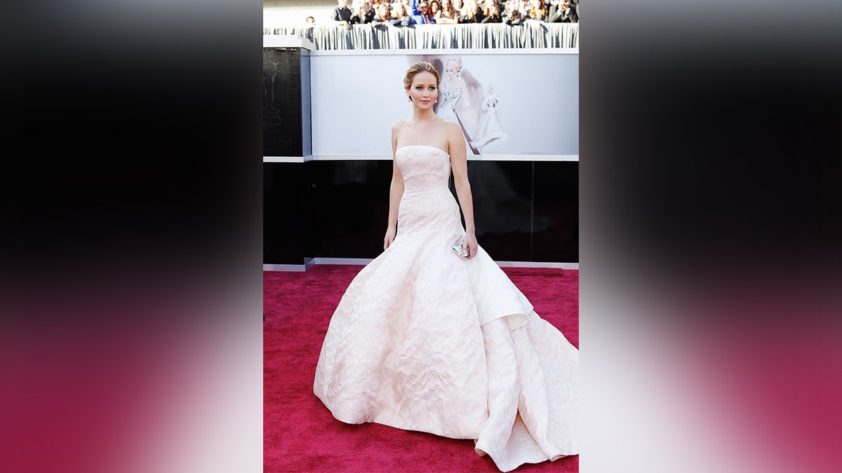 Jennifer Lawrence famously tripped while walking up the stairs in a white Dior ballgown.