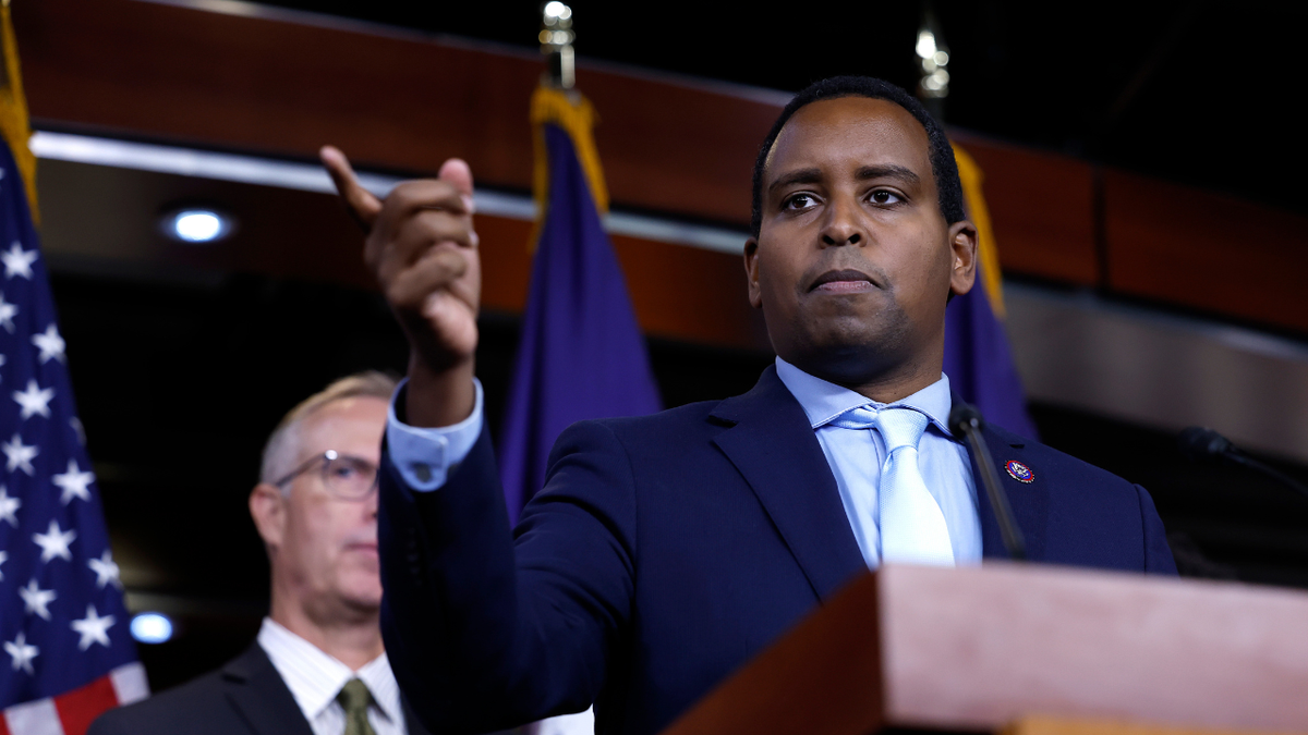 Representative Joe Neguse speaks at a press conference