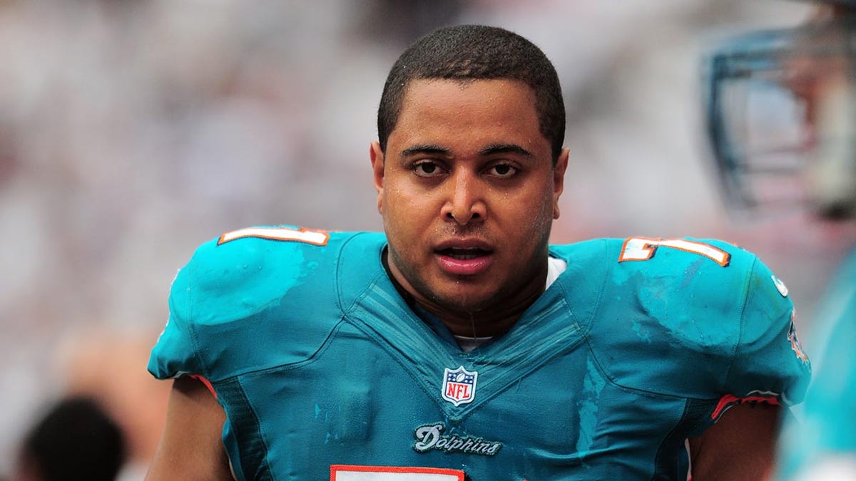 Jonathan Martin looks on field