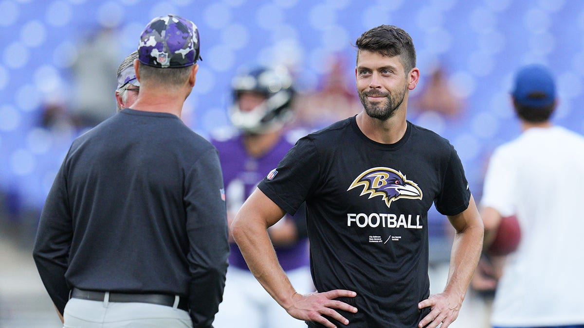 Justin Tucker and John Harbaugh