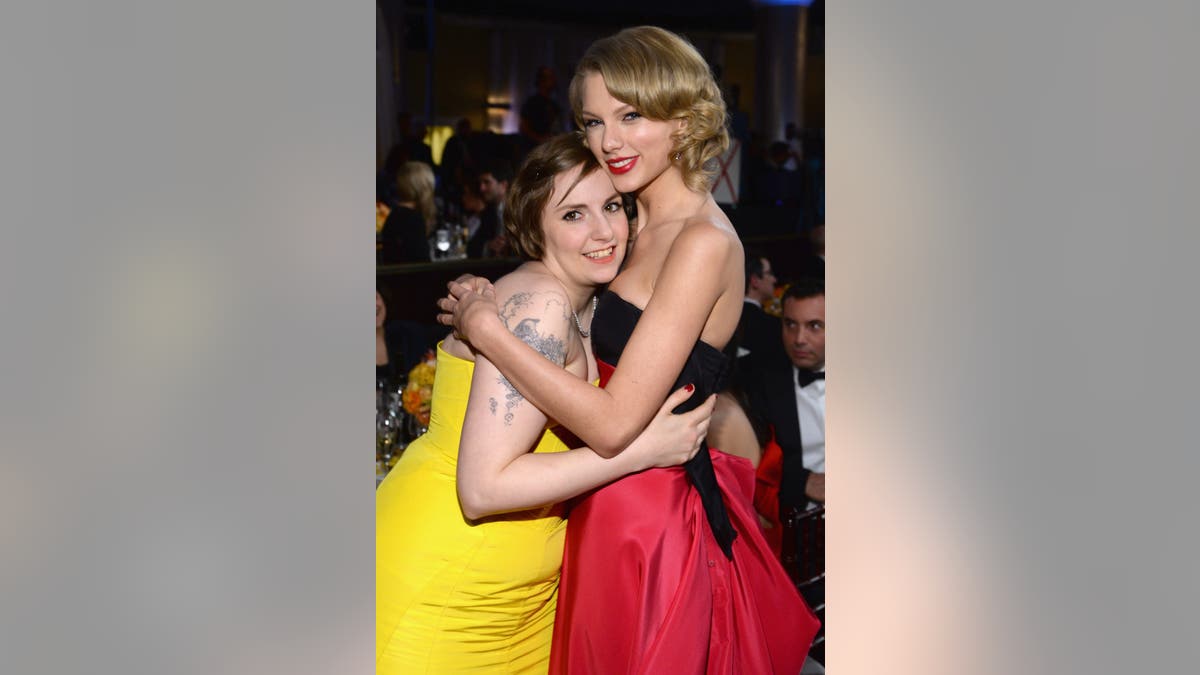 Lena Dunham hugging Taylor Swift