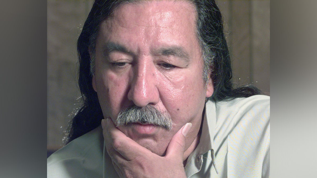 Leonard Peltier looks on during an interview