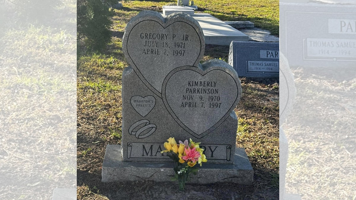 The gravestone of Greg and Kimberly Malnory, who were killed in 1997 