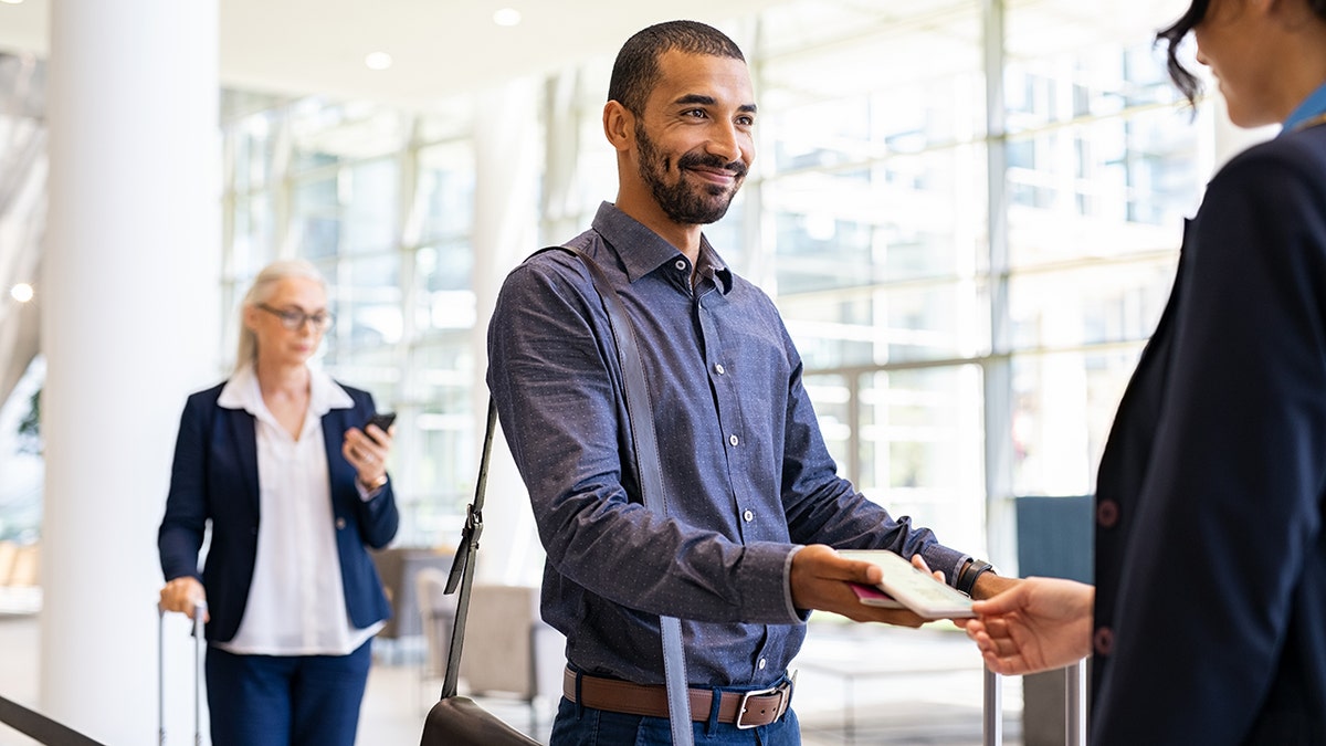 Someone with an agent about to board the plane