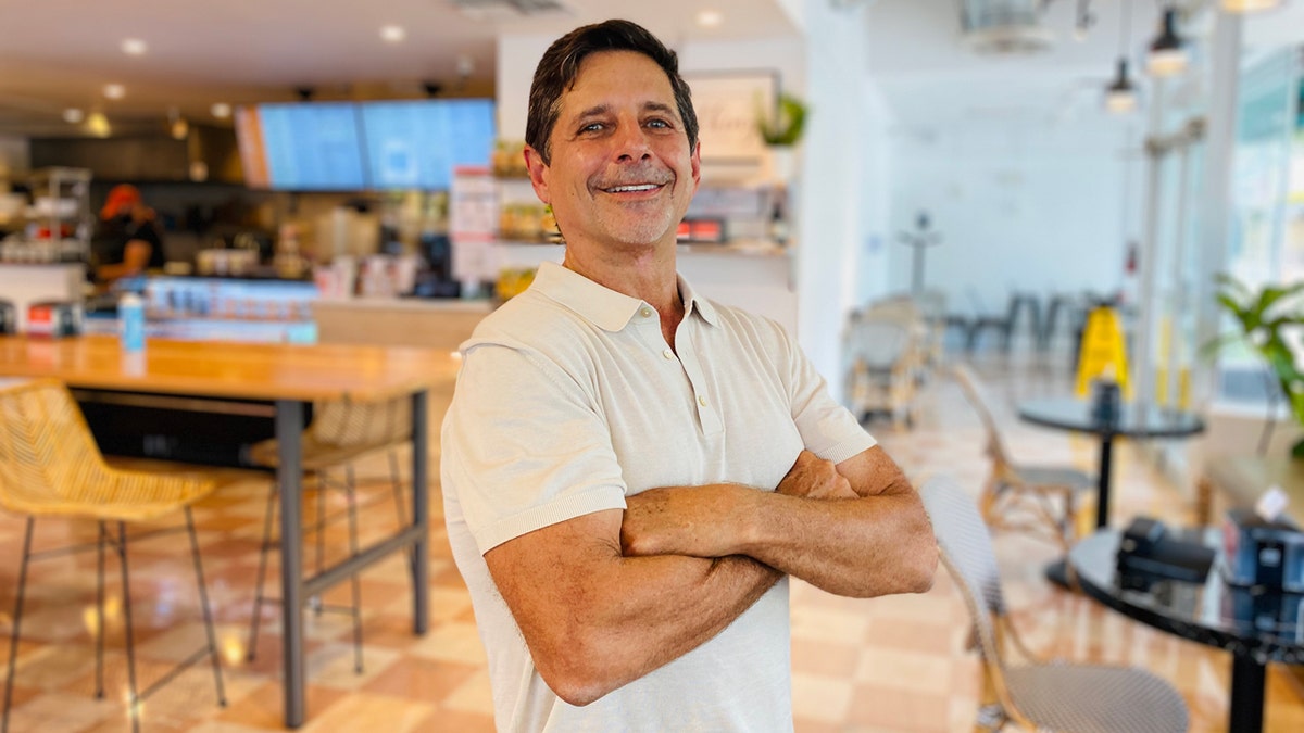 Mario Laufer poses for a photograph at one of his Carrot Express locations.