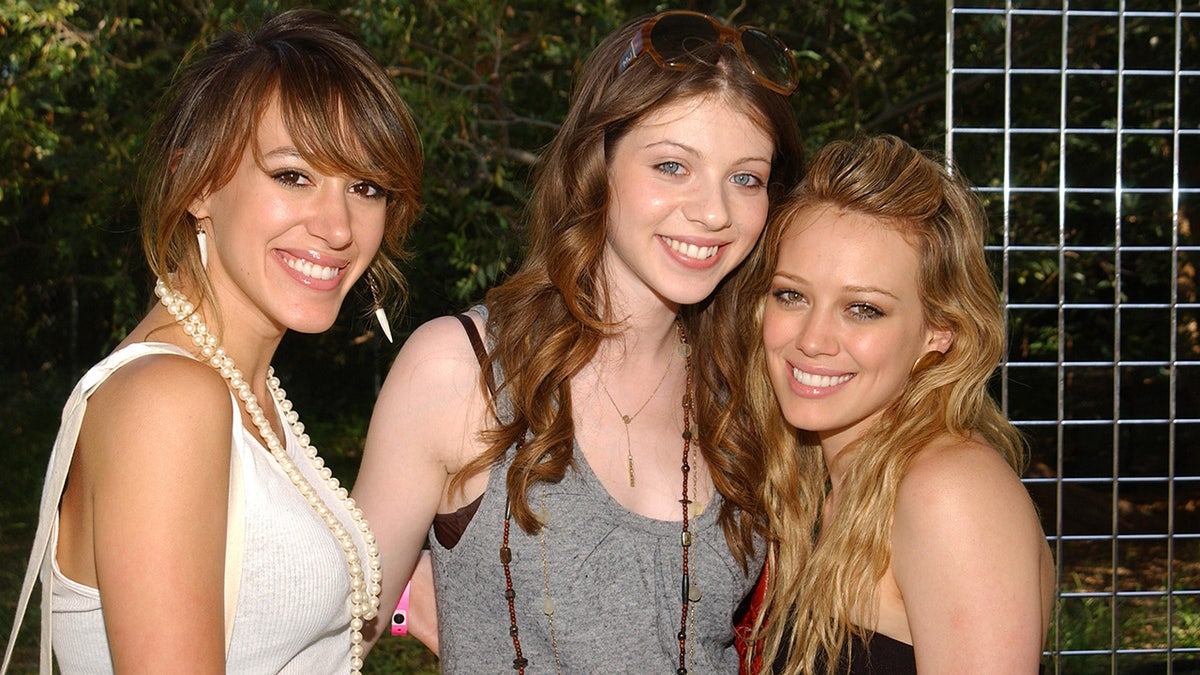 Haylie Duff, Michelle Trachtenberg and Hilary Duff smile for a photo