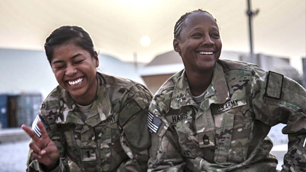 Capt. Jennifer Moreno laughs alongside retired First Sgt. Catherine Harris