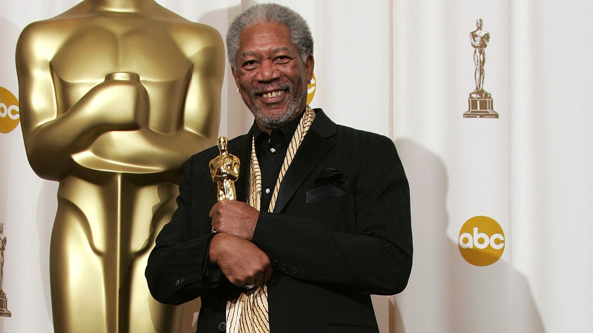 Morgan Freeman holding his Academy Award at the 2005 Oscars.