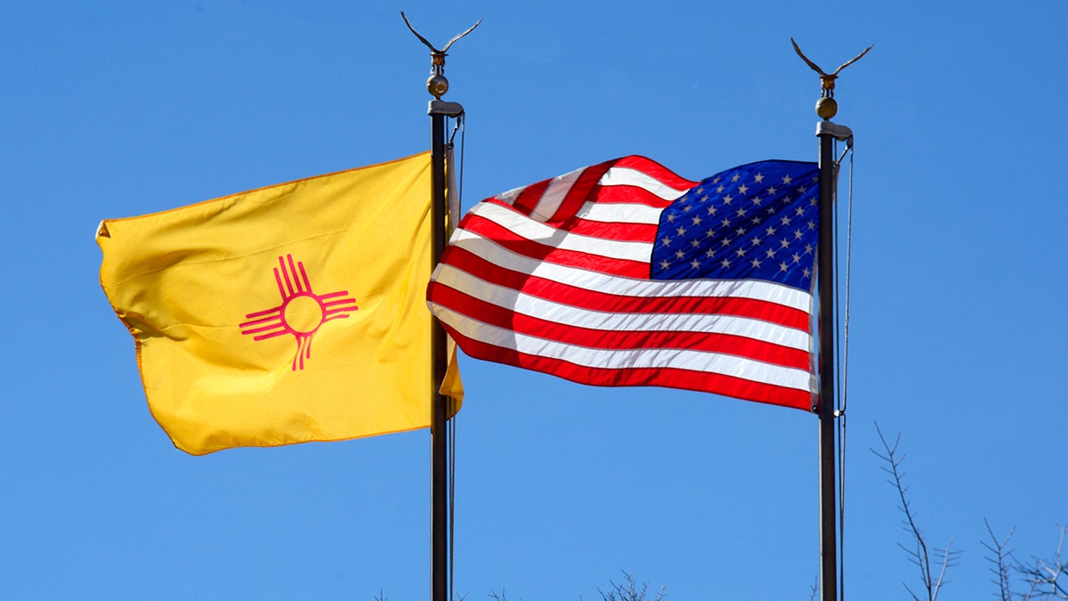 New Mexico and American flags flying