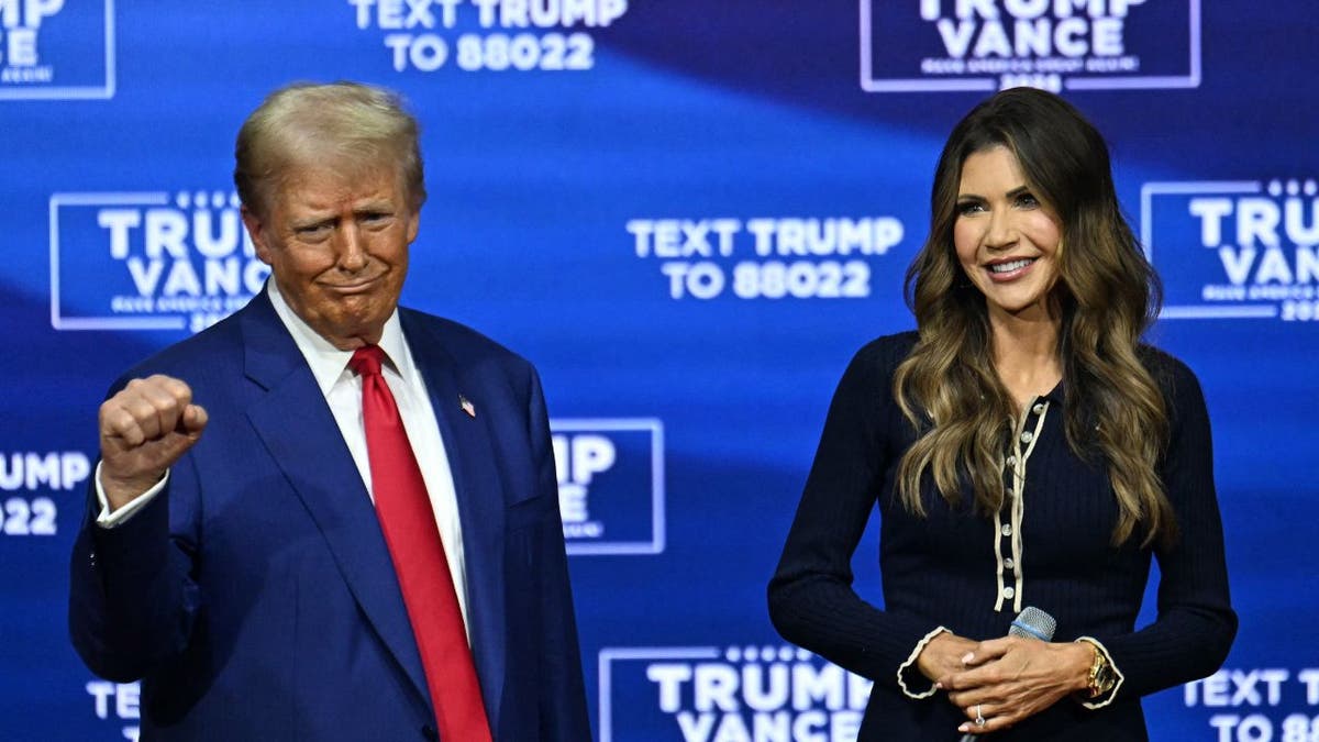 President Donald Trump and then South Dakota Governor Kristi Noem