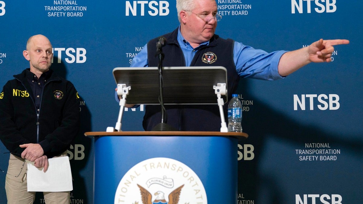 National Transportation Safety Board member Todd Inman speaks with reporters at Ronald Reagan Washington National Airport, Saturday, in Arlington, Va.