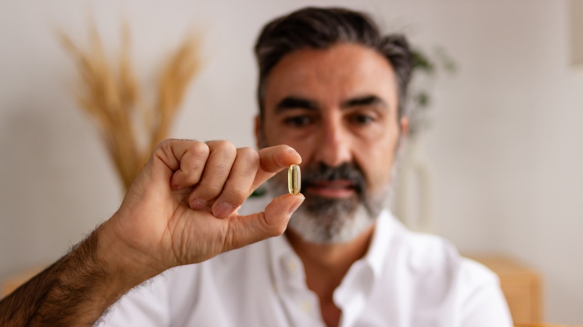 Man holds pill