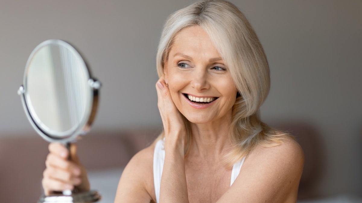 Older woman's hand mirror