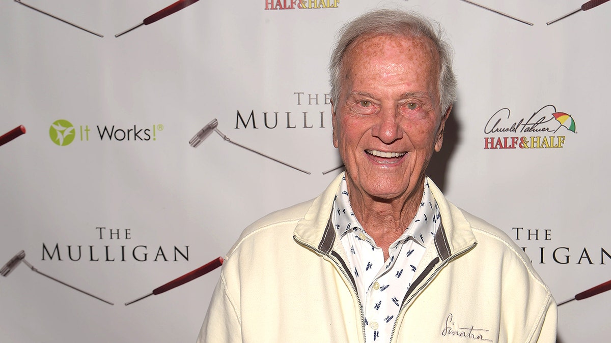 Pat Boone smiling on red carpet