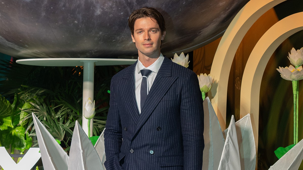 Patrick Schwarzenegger poses