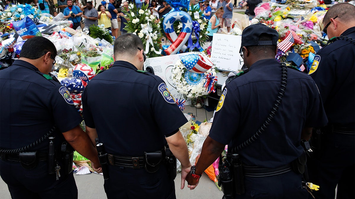 Dart Police Officers pray