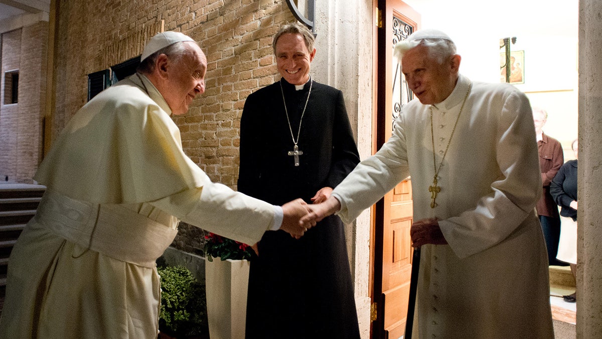 Pope Francis greets Pope Benedict XVI