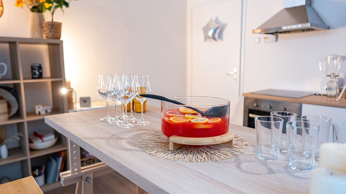 Drink glasses and hit in a glass bowl, on the table in the kitchen