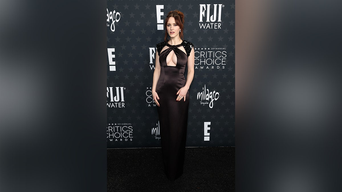 Rachel Brosnahan stunned in a black dress with keyhole cutouts on the chest.