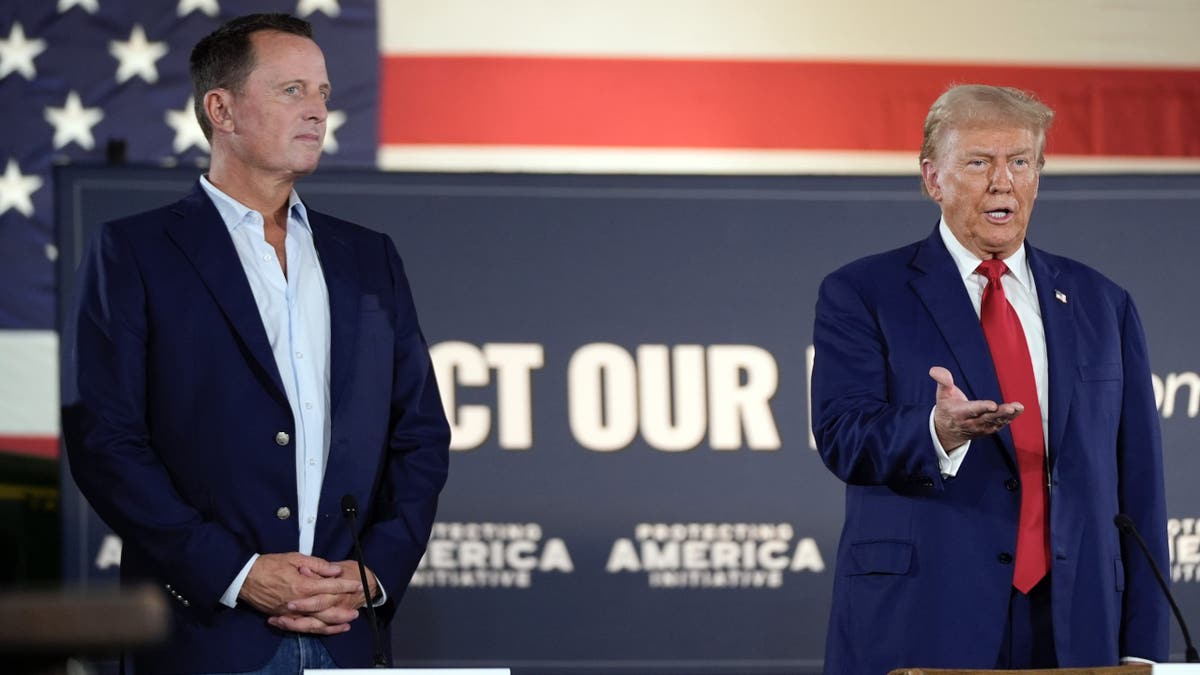 FILE - Then-former President Donald Trump speaks next to Richard Grenell during a presidential election campaign event at a farm in Smithton, Pa., on Sept. 23, 2024.